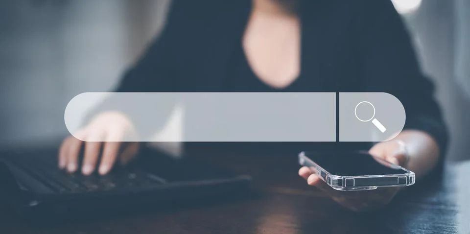 Searching Browsing Internet Data Information with blank search bar. man's han Stock Photos