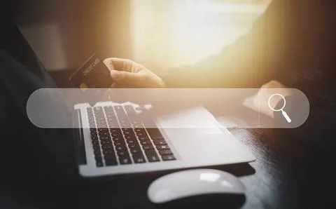 Searching Browsing Internet Data Information with blank search bar. man's han Stock Photos