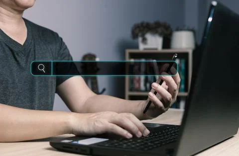 Searching Browsing Internet Data Information with blank search bar.handof b.. Stock Photos