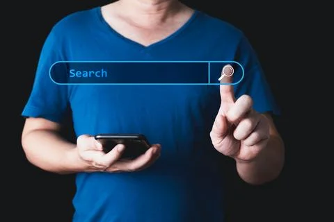 Searching Browsing Internet Data Information with blank search bar. hand of.. Stock Photos