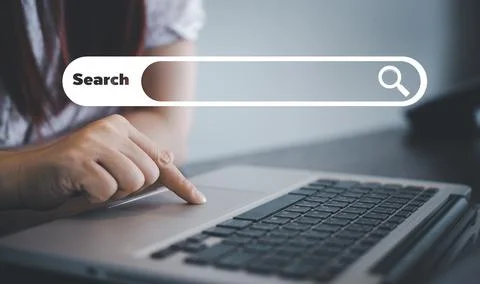 Searching Browsing Internet Data Information with blank search bar. man's han Stock Photos