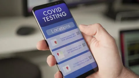 Searching for a Covid Testing Location on a Smart Phone Mobile App Stock Footage 166241109