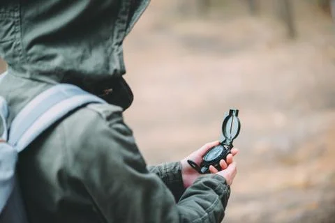 Searching direction with a compass Stock Photos
