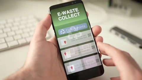 Searching for an E Waste Collect Point on a Smartphone to Recycle Electronics Stock Footage