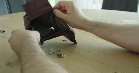 Searching Empty Wallet for Money at Table Stock Footage 337759668