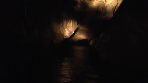 Searching for an Exit in a Cave with a Flashlight Stock Footage 51897003
