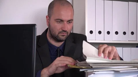 Searching file in paperwork stack well-dressed corporate employee in the office Stock Footage 80566308