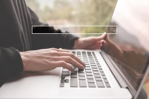 Searching information data on internet networking concept. Women use laptop t Stock Photos