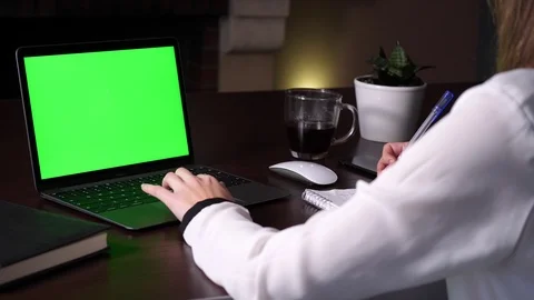 Searching an information on green screen in laptop and writing it down to Video stock 101309515