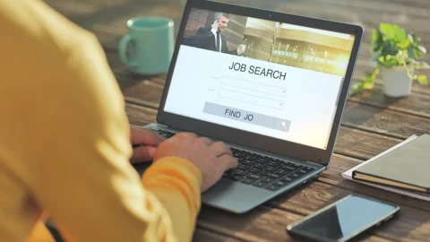 Searching job at the computer on internet web site Stock Footage 311936252