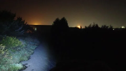 Searching For Missing Person At Night Using Police Flashlight Back And Forth Stock-Footage 153561995