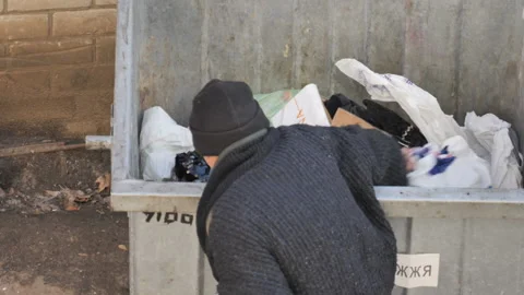 Searching recyclable materials in garbage. Concept: social problem, poor country Stock Footage 121445233