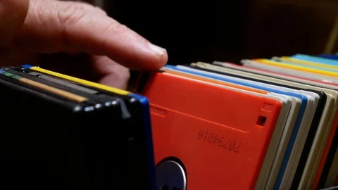 Searching for red  floppy disk in storage box. Stock Footage 107694173