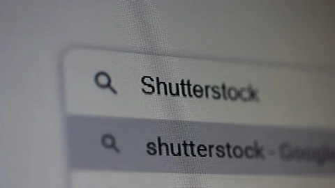 Searching for "Shutterstock" in an Internet Search Engine on a Computer. 4K. Stock Footage 150874199