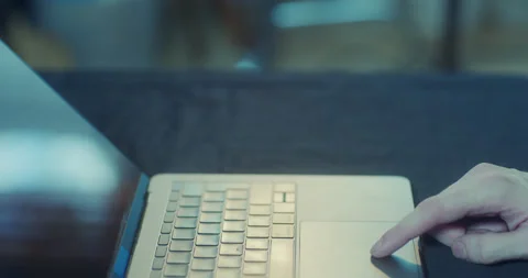 Searching for something on a laptop using the touch pad Stock Footage 130576346