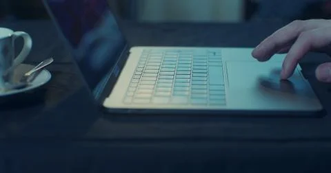 Searching for something on a laptop using the touch pad Stock Photos