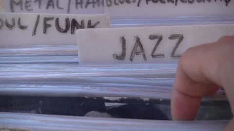 Searching through old and used records Stock Footage 64146014