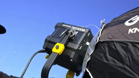 Searchlight with softbox at shooting set against clear sky Stock Footage 324915452