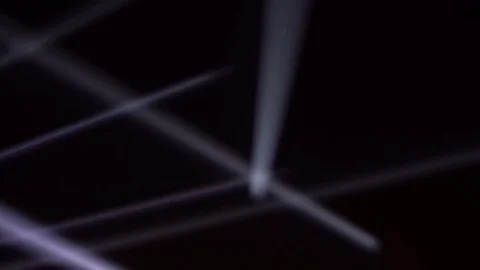 Searchlights on the night black sky. Stock Footage 100897310