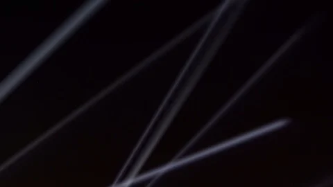 Searchlights on the night black sky. Video stock 100897333