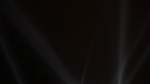 Searchlights shining beams of light into the sky Stock Footage 88921568