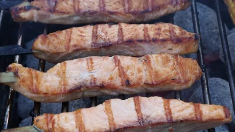Seared Salmon Steaks Cooking On A BBQ, UK Stock Footage 151737087
