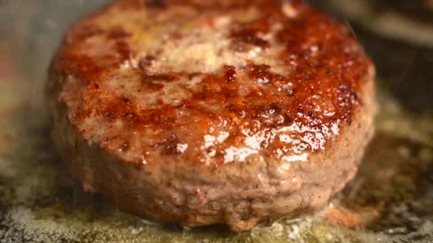 Searing a Beef Patty (Slow Motion) Stock Footage 330278515