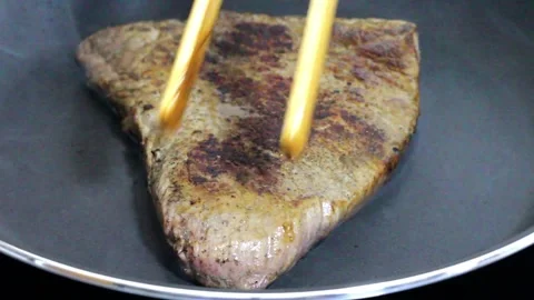 Searing a delicious steak Stock Footage 282534913