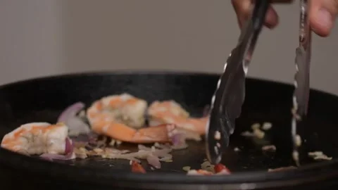 Searing Raw Shrimp in Cast Iron Pan Close Up Seafood Cooking Stock-Footage 329140870
