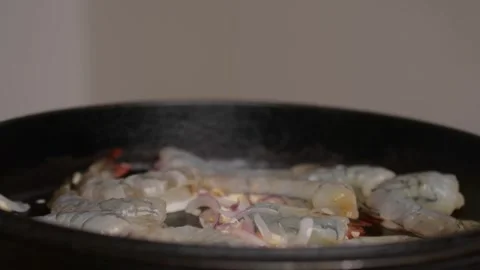 Searing Raw Shrimp in Cast Iron Pan Close Up Seafood Cooking Stock Footage 329140872