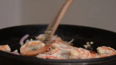 Searing Raw Shrimp in Cast Iron Pan Close Up Seafood Cooking Stock-Footage 329140874