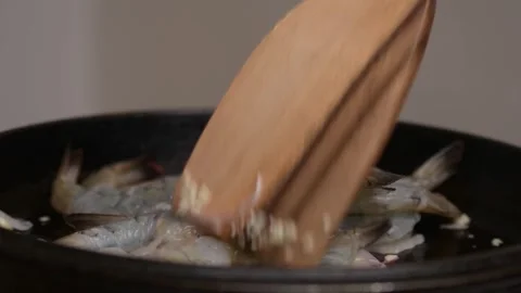 Searing Raw Shrimp in Cast Iron Pan Close Up Seafood Cooking Stock Footage 329140875