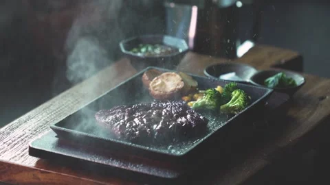 Searing Steak on Hot Pan Stock Footage 334172330
