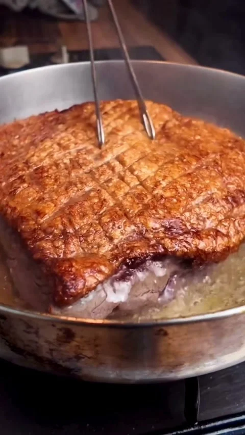 Searing a Thick Cut of Meat in a Stainless Steel Pan Video stock 331947464