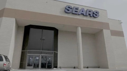 Sears Storefront Entrance Doors while Snowing in Colorado Springs, Colorado Video stock 100521343