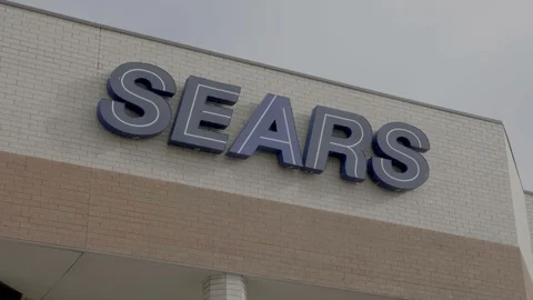 Sears Storefront Sign Centered Snowing in Colorado Springs, Colorado Stock Footage 100521314