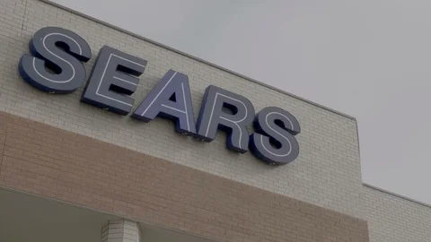 Sears Storefront Sign Closeup while Snowing in Colorado Springs, Colorado Stock Footage 100521329