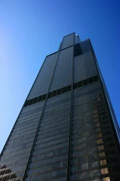 Sears tower from below on blue sky Stock Photos