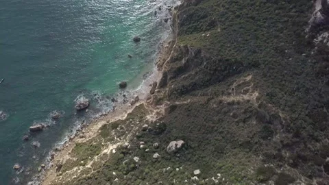 Seascape Aerial Shot saddle of the devil (sella del diavolo) with calm sea in Stock-Footage 146311280