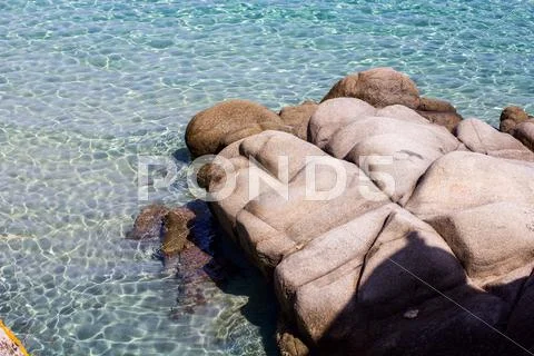 Seascape and rocks shore, beautiful turquoise sea on the summer day. Stock Photos