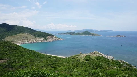 Seascape of bay and shore in summer day with white clouds in time-lapse running Stock Footage