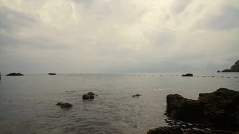 Seascape with breakwaters at sunset Stock Footage 95727097