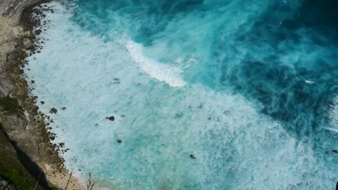 Seascape dark ocean background wave splash on rock. Tropical sea Stock Footage 317429261