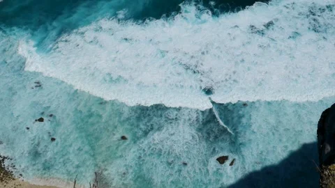 Seascape dark ocean background wave splash on rock. Tropical sea Stock Footage 317429265
