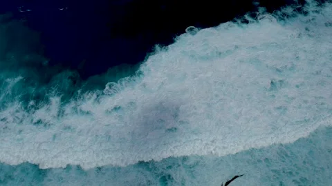 Seascape dark ocean background wave splash on rock. Tropical sea Stock Footage 317429280