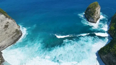Seascape dark ocean background wave splash on rock. Tropical sea Stock Footage 317429281
