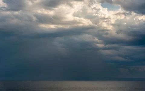 Seascape dramatic stormy clouds. Strom in the horizon. Rainy winter day in the Stock-Fotos