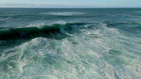 Seascape With Huge Foamy Waves Rolling Onto Shoreline. Aerial Wide Shot 動画素材 252831699
