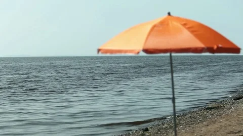 Seascape parasol on empty beach Stock Footage 72747913