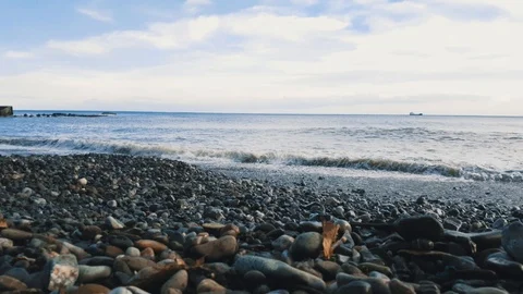 Seascape with pebble beach Stock Footage 103468778